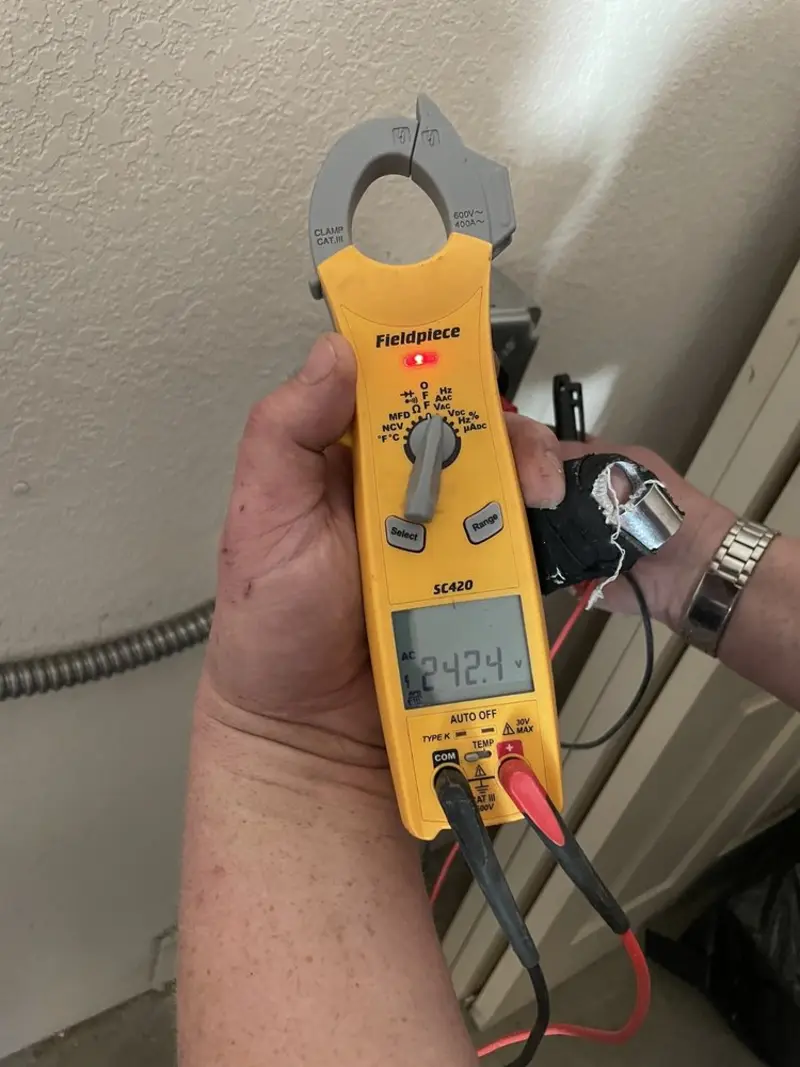 Voltage testing with clamp meter during Circuit Breaker Repair in Evergreen